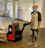 Baker participant Angel using a pallet jack