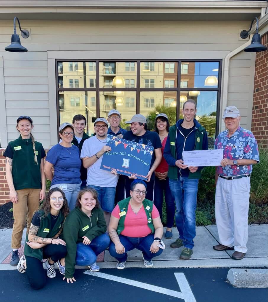 Kimberton Whole Foods presented Baker Industries with a check for