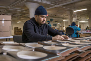 Baker Employee Assembling Products