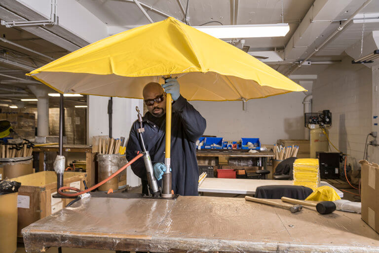 Baker Employees Assembling Umbrellas