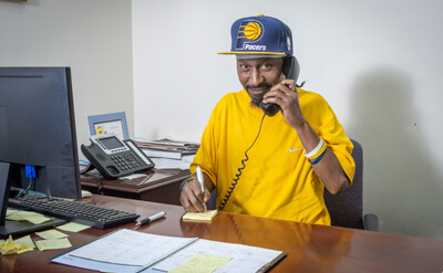 Baker Employee on telephone