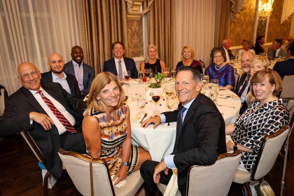Guests gathered at a dinner table during the 2025 Baker Industries Gala
