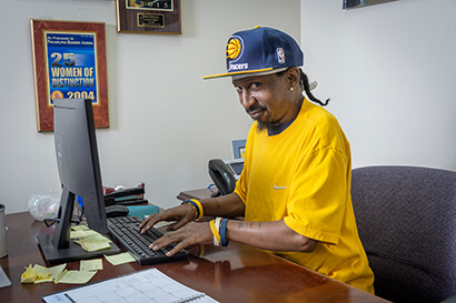 Baker Employee works on a computer at our offices