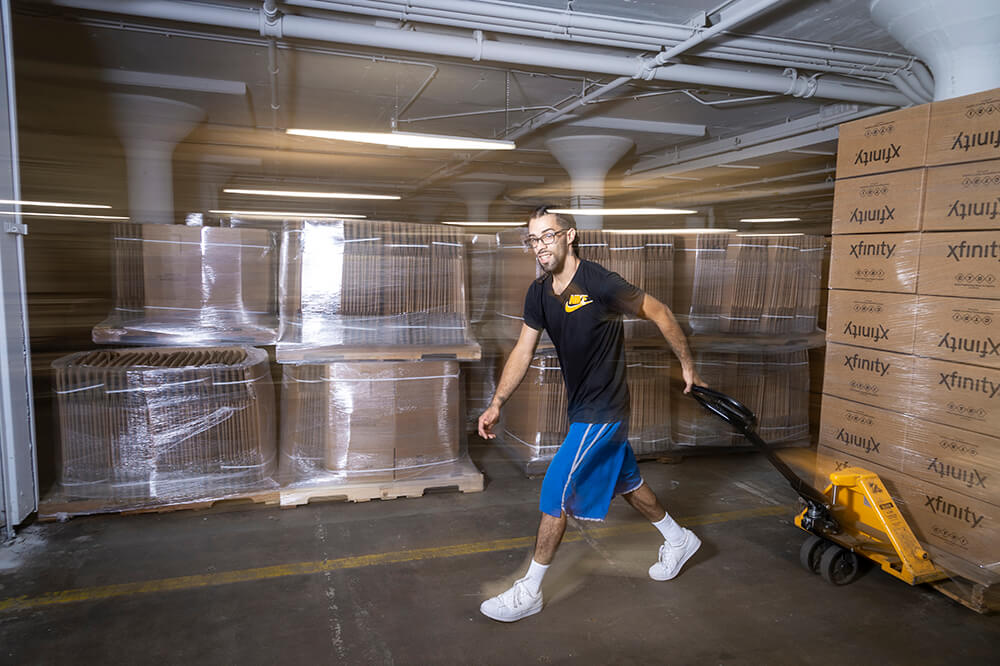 Baker Employee pulling pallet jack