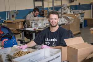 Baker Employee packs together supplies